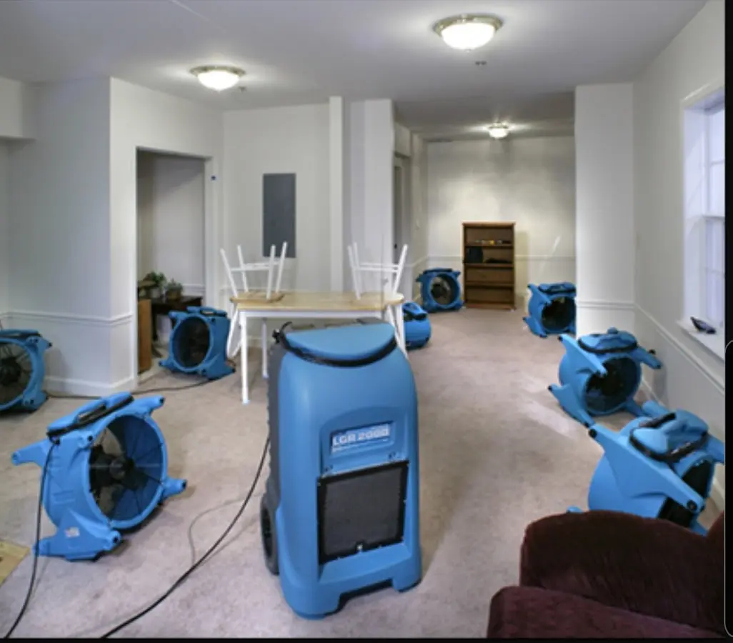 Air movers and dehumidifier setup for Water Damage Restoration in Winder